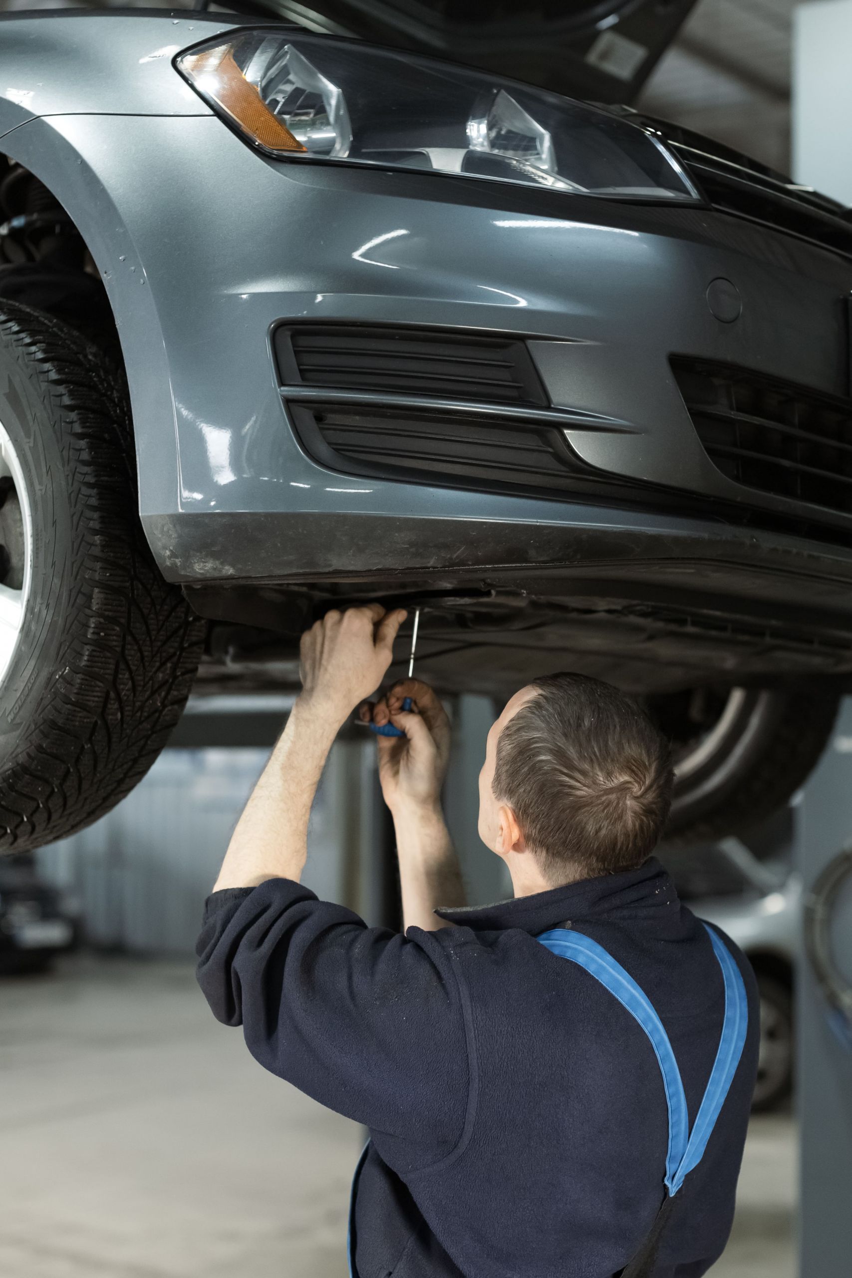 auto-service-worker-with-lifted-vehicle-car-repai-2024-09-22-23-29-21-utc (1)